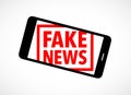 VFake news rubber stamp on a cell phone