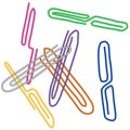 Messy scattered colorful paperclips. Dispersed paper clips