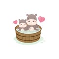 Happy hippo and baby in the wood bath tub.