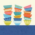 Stacked colorful kitchen bowls with mid century modern designs. Royalty Free Stock Photo