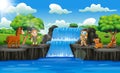 Happy zookeeper boy and girl in waterfall scene Royalty Free Stock Photo