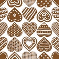 Christmas seamless vector pattern with iced gingerbread heart cookies