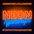 Orange neon alphabet font. Light bulb letters and numbers. Stock vector typescript for your typography design.