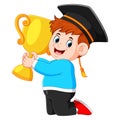 The boy is holding the trophy in his graduations day
