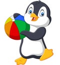 Cartoon penguin holding beach ball