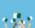 Vector illustration of hands holding Algeria flags