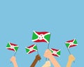 Vector illustration of hands holding Burundi flags