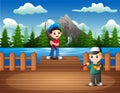 Happy boys fishing on the wooden pier Royalty Free Stock Photo