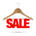 Sale sign on a wooden hanger