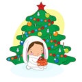 A child holds a gift on the background of a Christmas tree.