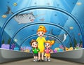 Mother and kids walk thru underwater museum Royalty Free Stock Photo