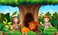 Zookeepers and lion under the hollow tree Royalty Free Stock Photo