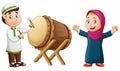 Cartoon happy girl and boy hitting mosque drum Royalty Free Stock Photo