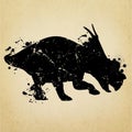 Triceratops dinosaur - grunge silhouette isolated on vintage paper