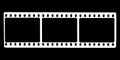 Black film strip icon in isolate on a black background. Royalty Free Stock Photo