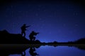 Silhouette Soldier shooting with gun in night sky background.Gradient starry night background