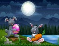 Happy Easter bunnies at night landscape Royalty Free Stock Photo