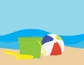 Colorful beach ball, Green toy bucket and Yellow toy shovel on Brown sand, Royalty Free Stock Photo