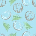 Whole and open coconuts on blue background. Seamless pattern with coco and leaf. Royalty Free Stock Photo