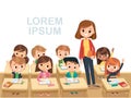 Teacher with pupils in a classroom. Primary school kids. Royalty Free Stock Photo