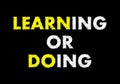 Learning or doing writing text on black chalkboard. learning concept Royalty Free Stock Photo