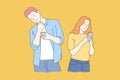 The pensive couple uses a smartphone