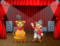 A lion circus with trainer performing on the stage Royalty Free Stock Photo