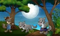 Three wolves hunt at night Royalty Free Stock Photo