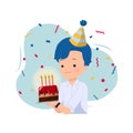 Handsome man holding a cake to celebrate his birthday decorated with party hat and confetti. Office boy celebration. Royalty Free Stock Photo