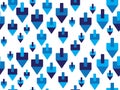 Blue White Jewish holiday Hanukkah dreidels seamless background Royalty Free Stock Photo