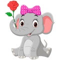 Cute baby elephant girl sitting with a flower