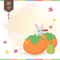 Chuseok Korean Thanksgiving Day - rabbit with persimmons & songpyeon Royalty Free Stock Photo