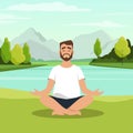 Bearded man doing meditation at the lake