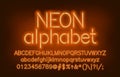 Neon alphabet font. Yellow neon light uppercase and lowercase letters and numbers.