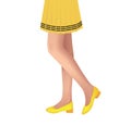 Woman legs with yellow shoes