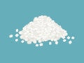 Heap of granulated sugar isolated on blue background.