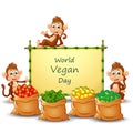 World Vegan Day text design on sign with vegetables and monkeys