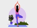 Young woman stands in a Yoga Pose tree and meditates. Royalty Free Stock Photo