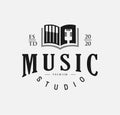 Open music book logo design with black piano and mic For Music Studio.