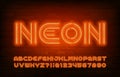 Neon alphabet font. Orange neon light letters and numbers in 70s style. Royalty Free Stock Photo