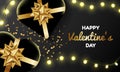 Luxury black and gold valentine`s day banner design decorated with lights and heart shape present box.
