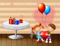 Children couple boy and girl holding a red heart on Valentine`s Day