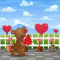 Bear carrying a plate of red heart in road park