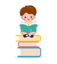 Cute little school children sitting and reading a book on stack of books, happy pupil reading a book at a top of a books heap Royalty Free Stock Photo