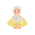 Hijab woman touch her stomach while feeling pain because of menstrual cramp or stomachache.