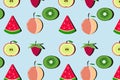 Fruit pattern with peach, kiwi, watermelon, raspberry on blue background. Royalty Free Stock Photo