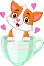 Cartoon cute kitten sitting in a cup with pink hearts Royalty Free Stock Photo