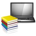 Close up of stack of colorful books and laptop Royalty Free Stock Photo