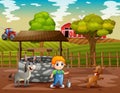 Young farmer and animals in the farmland Royalty Free Stock Photo