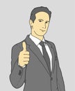 Businessman showing thumbs up with graybackground.